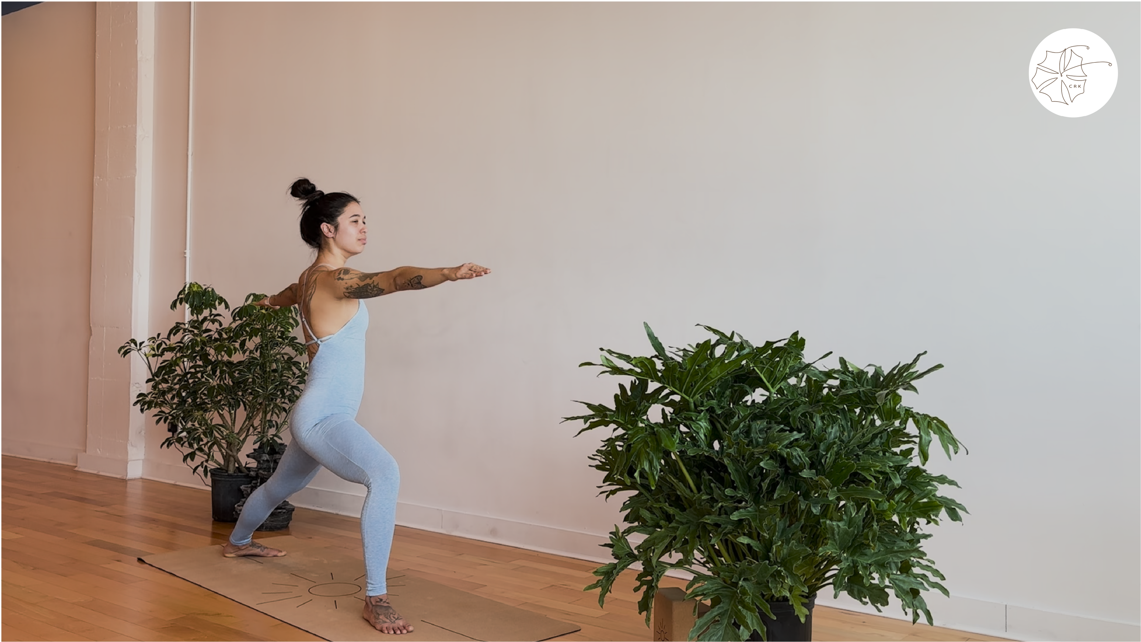 Girl doing warrior two yoga pose